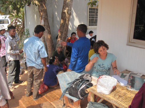 Filling in arrival forms Thai border